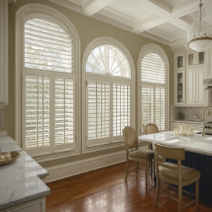 Plantation shutters on tall arched windows, built to last for decades